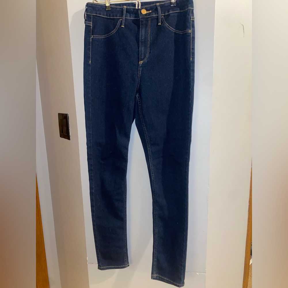 Dark wash, high waist skinny jeans.